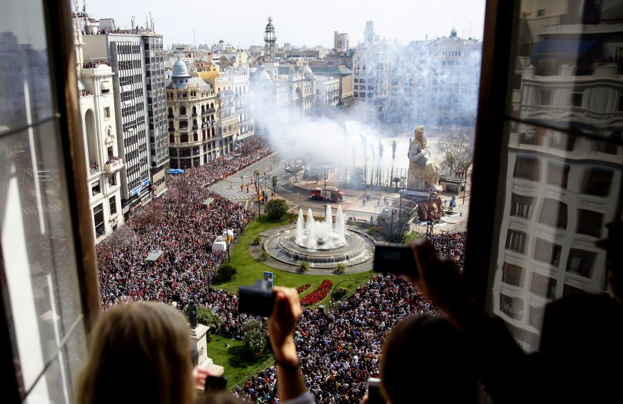 From a high window, a view over Plaza Ayuntamiento square, where the crowd takes part in the celebration of Las Fallas